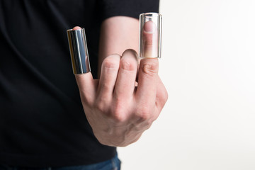 Fototapeta premium The guitarist's hand with two guitar sliders on his fingers. Horizontal frame