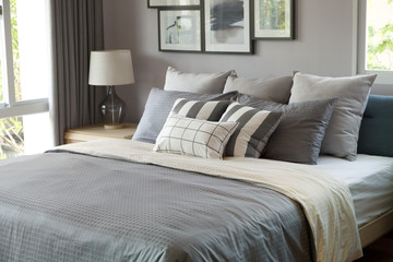 grey pillow on bed in home bedroom