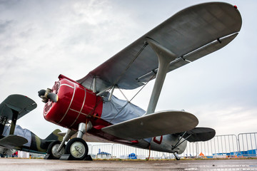 Retro biplanes in the parking lot under a little rain © Dushlik