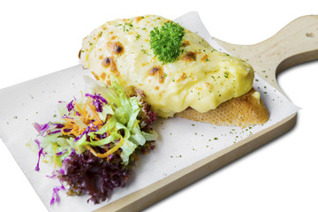 Cheese bread with salad on bake paper