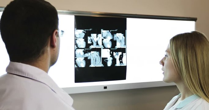 4K Healthcare, medical. Doctors are examining an X-ray.
