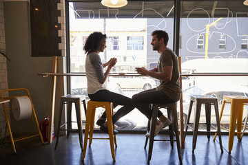 Couple Meeting For Date In Coffee Shop - obrazy, fototapety, plakaty