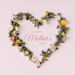 Heart of nature with happy Mothers day text. Love concept. Flat lay. © Zamurovic Brothers