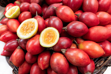 Traditional market stall full of fresh red maracujas