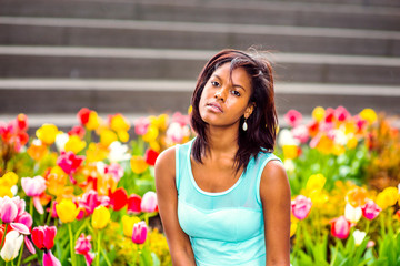 Portrait of Young African American Woman with flowers in New York