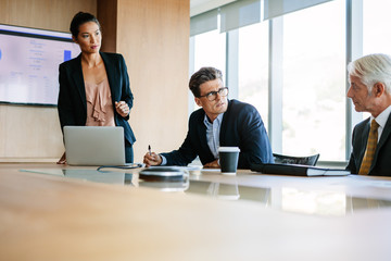 Businesspeople sitting at corporate meeting