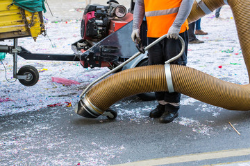 Street cleaner with industrial vacuum cleaner. Municipal cleaning service, clean streets.