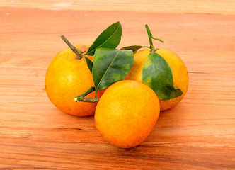 ripe tangerine on wooden background