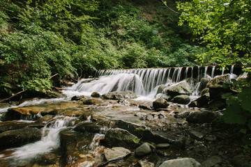 Beautiful landscape. The mountain river. Stones in a mountain river. Mountains of the Carpathians
