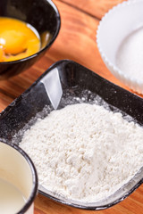 American pancakes recipe ingredients on the rustic wooden table