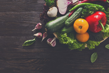 Plenty of fresh vegetables on wooden background with copy space