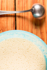 American pancakes mixture compound over flat lay wooden rustic background