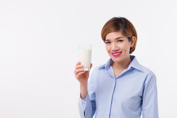 healthy asian woman holding glass of milk