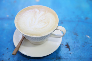 cappuccino coffee in blue vintage