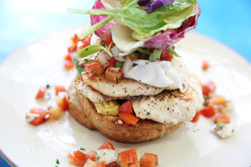 Eggs benedict with grilled chicken and bread