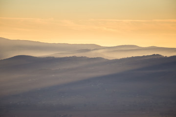 Sunrays over mountains at sunset
