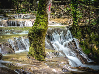 Mountain waterfal on hike path