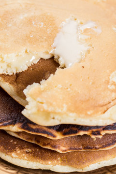 Closeup macro of american pancakes stuffed with chocolate cream on the plate