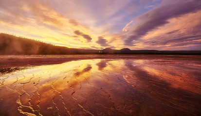 Fototapeta na wymiar Picturesque sunset at Grand Prismatic Spring in Yellowstone National Park, Wyoming, USA.