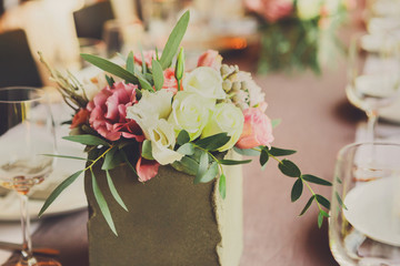 Served wedding table with flowers decorations