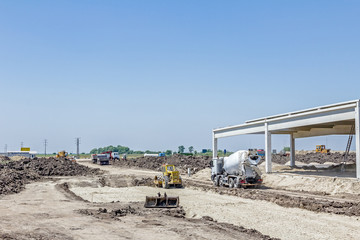 Concrete mixer passing over building site