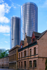 Fototapeta na wymiar New skyscrapers for old building