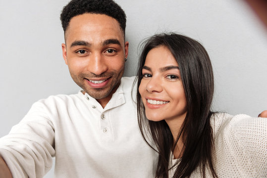 Smiling loving couple make selfie.