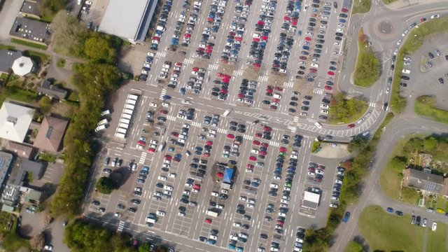 Aerial hyperlapse of busy parking lot at shopping mall