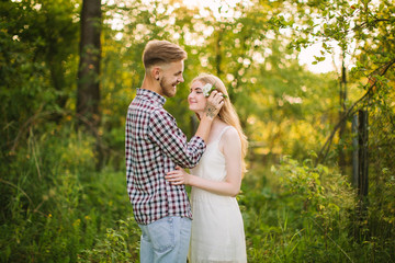 Beautiful Love story in the woods. Portrait of young stylish couple.