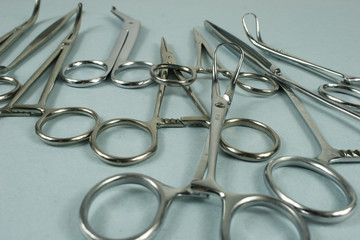 Medical surgical Instruments on blue background.