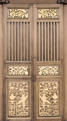 Ancient wooden door in an elegant Chinese culture.