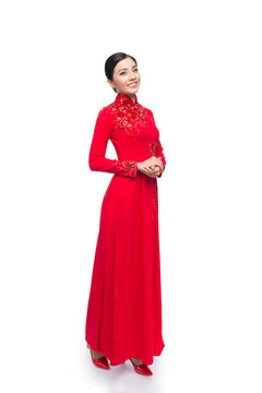 Full body of charming Vietnamese Woman in Ao Dai Traditional Dress isolated on white.