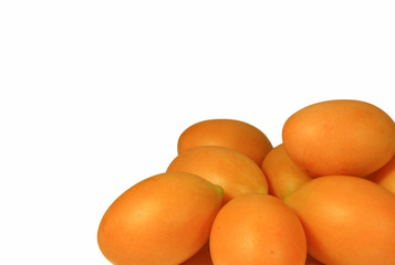 Closed up Heap of Vibrant Yellow Ripe Marian Plums Isolated on White Background 