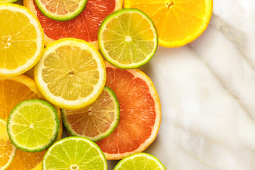 Obraz na płótnie Canvas Grapefruit, lime, lemon, and orange slices with copyspace
