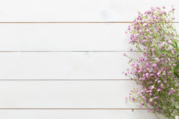 Mother's day background, white wooden table with pink flowers
