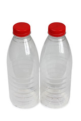 Plastic bottle with milk on white background