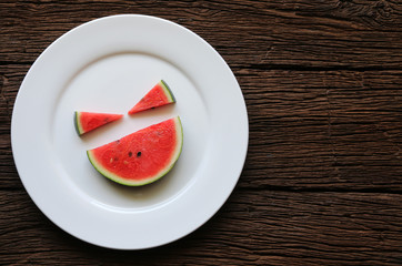 Watermelon smiles summer fruit in white plate