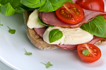 Ciabatta with ham , mozzarella, tomato and basil