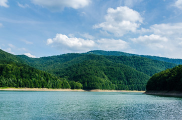 Beautiful landscape. Lake in the background of beautiful green mountains