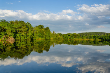 Fototapeta na wymiar Beautiful landscape. Lake in the background of beautiful green mountains