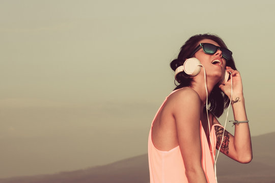 Happy girl listening to headphones