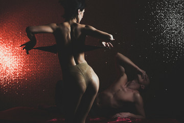 Fototapeta premium young couple of muscular macho man and pretty sexy woman