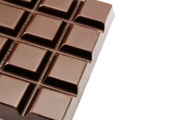 Bitter, dark chocolate bar, isolated on white background, close-up view