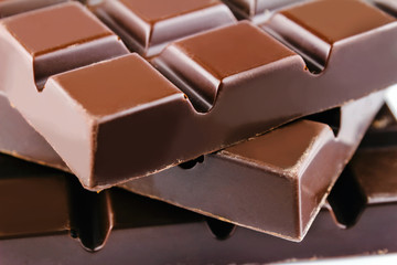 Three pieces of bitter, dark chocolate bar, close-up view