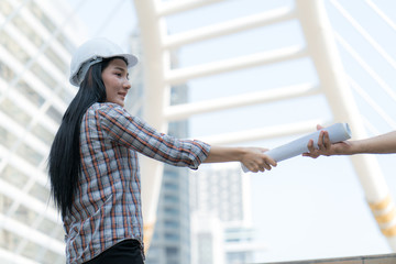 Asian Engineer Woman on activity in Site construction project