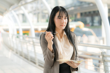 Asian Business Woman on Work Activity