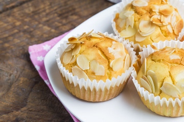 Tasty sugar muffins with almond and walnuts