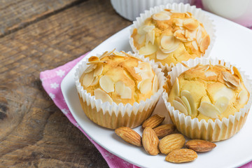 Tasty sugar muffins with almond and walnuts