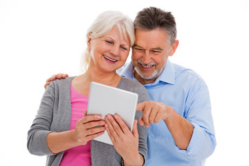 Elderly couple having fun with technology
