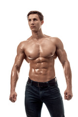 Muscular handsome young man with naked torso. Isolated on white background.